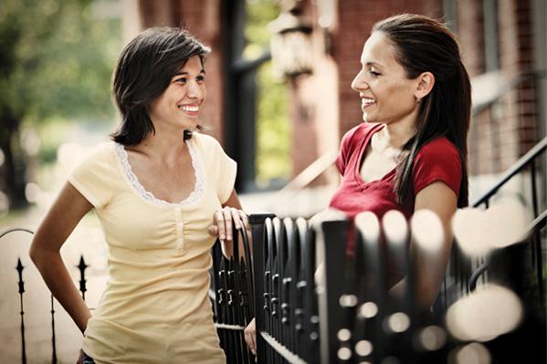 Women-Talking-at-Fence